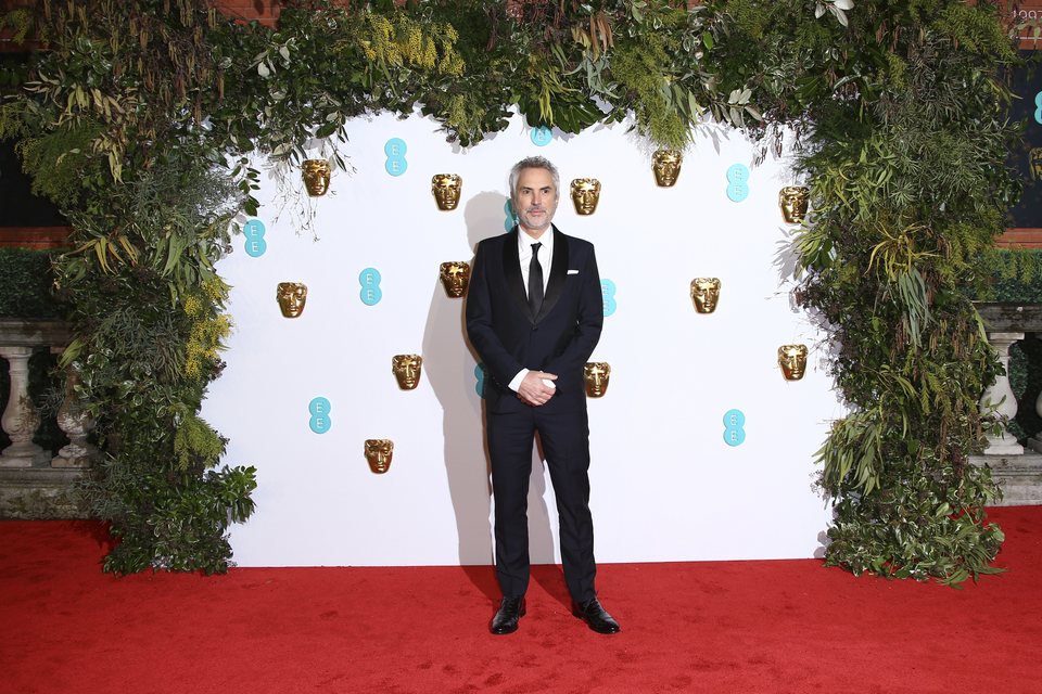 Alfonso Cuarón en la alfombra roja de los BAFTA 2019