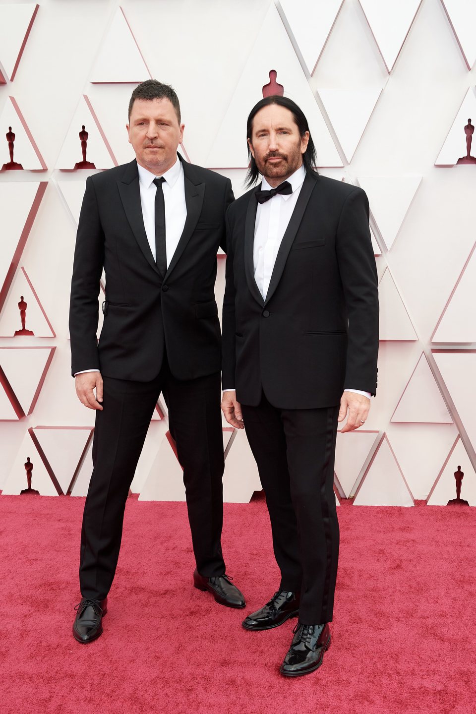 Atticus Ross y Trent Reznor en la alfombra roja de los Oscar 2021