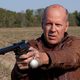 Bruce Willis apunta una pistola en 'Looper'