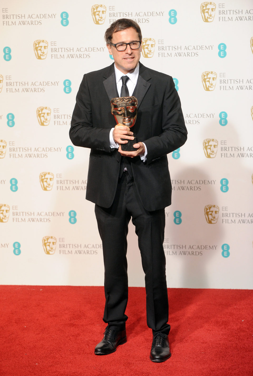 David O. Russell posa con su BAFTA 2013