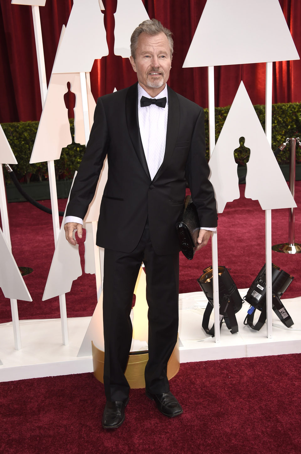 John Savage en la alfombra roja de los Oscar 2015