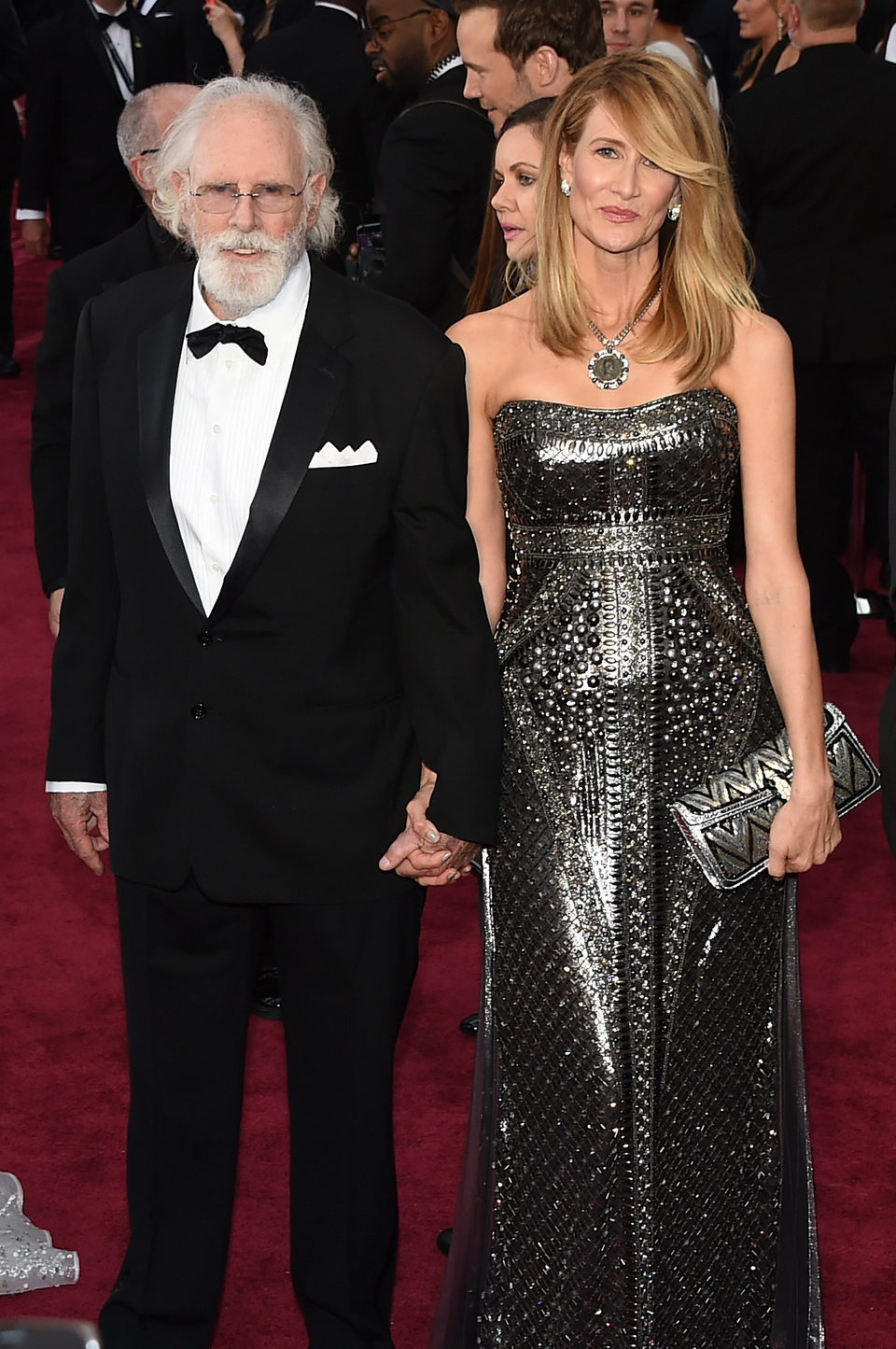 Bruce y Laura Dern en la alfombra roja de los Oscar 2015