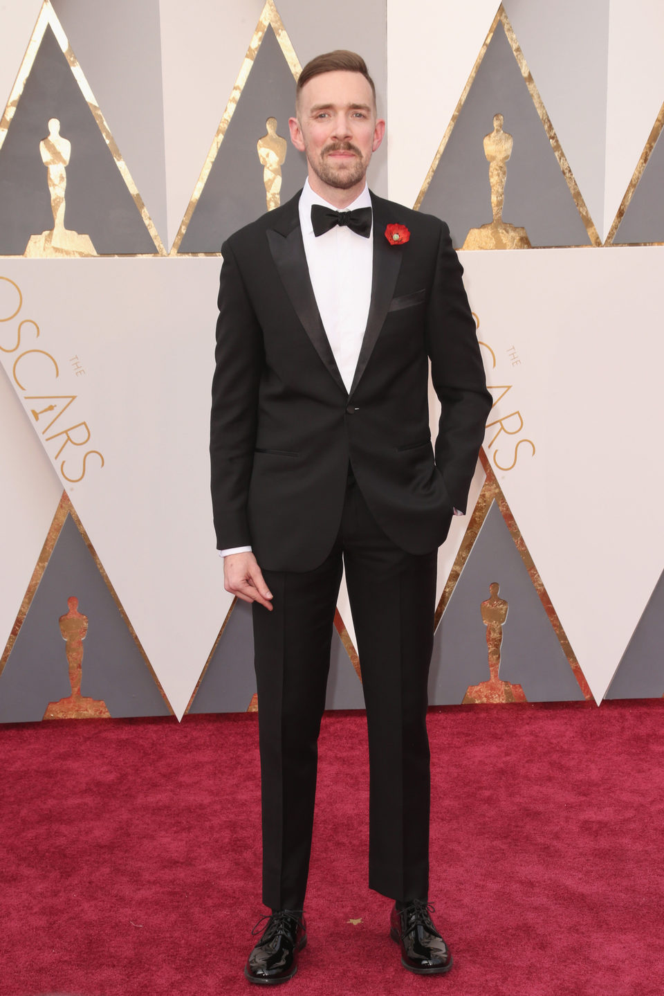 Henry Hughes en la alfombra roja de los Oscar 2016