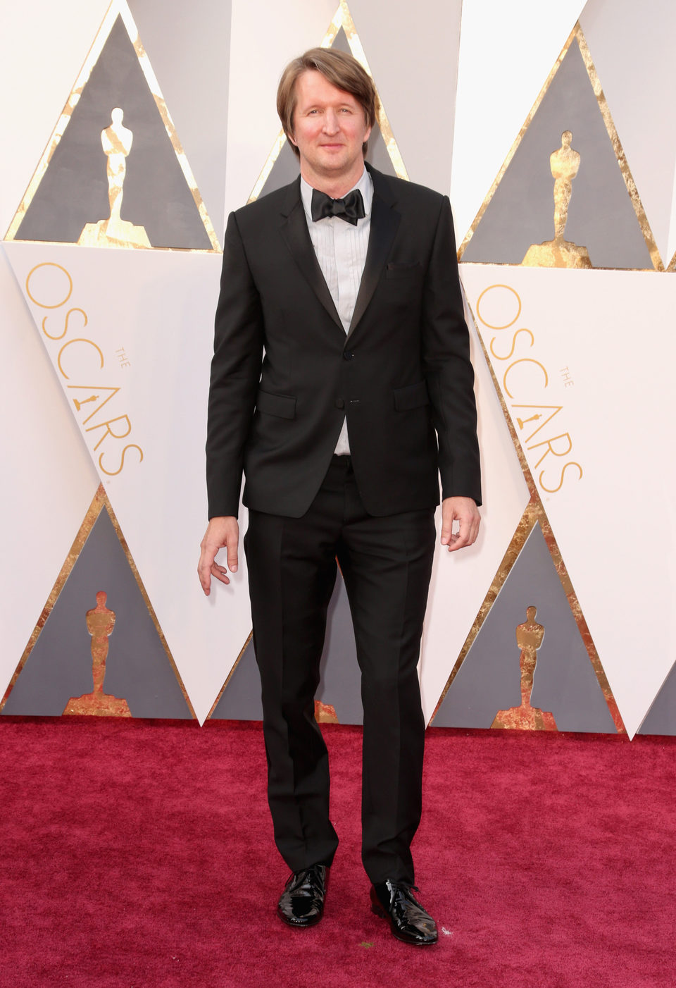 Tom Hooper en la alfombra roja de los Oscar 2016