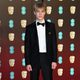 Tom Taylor en la alfombra roja de los BAFTA 2018