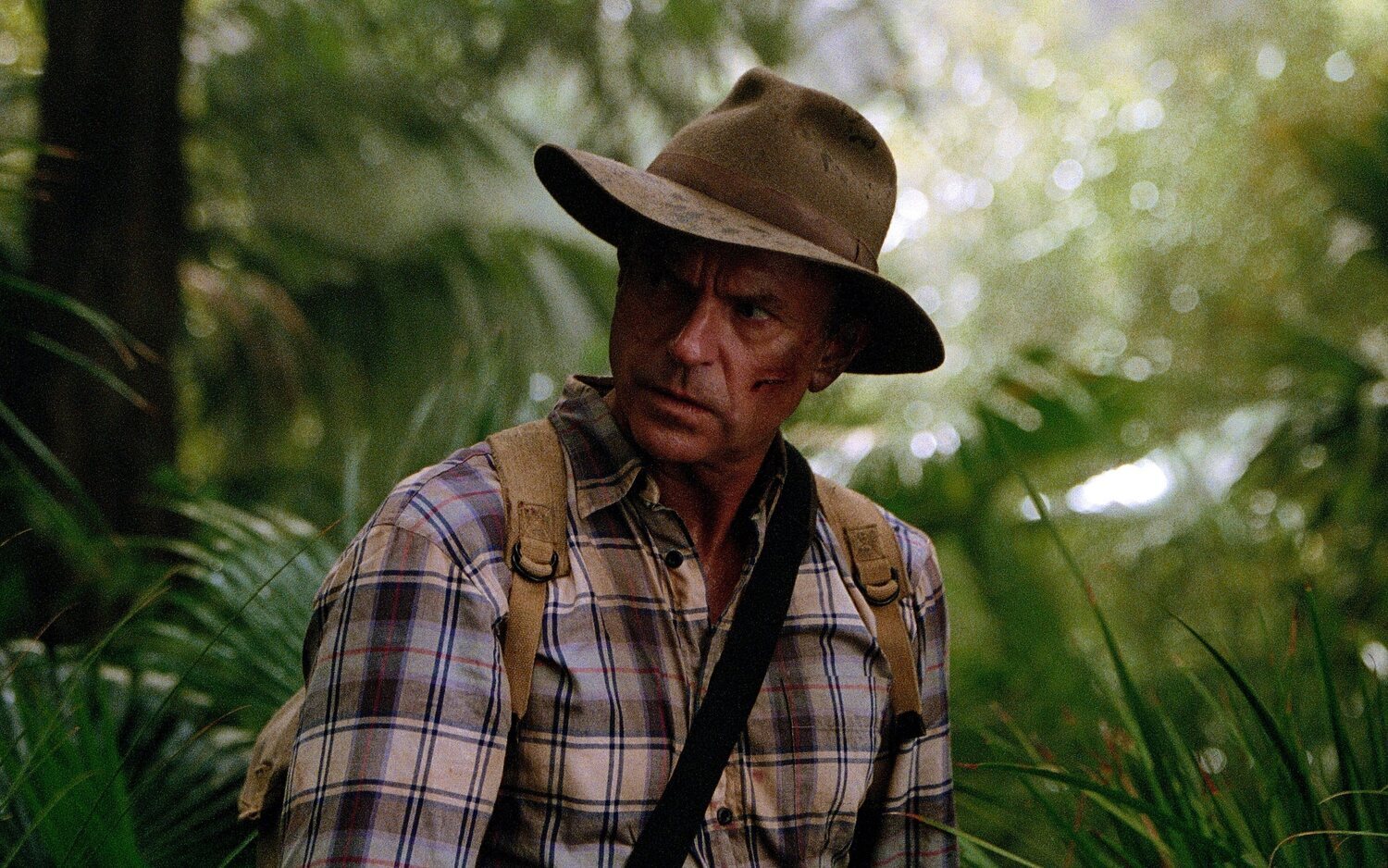 Sam Neill como Alan Grant en la saga de 'Parque Jurásico'