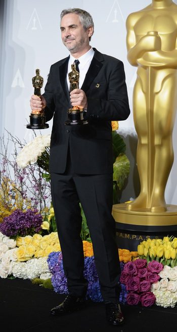 Alfonso Cuarón con sus Oscar 2014