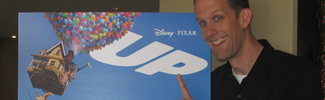 Peter Docter y un cartel de 'Up'